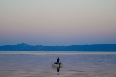 Scenic view of sea with mountain in background