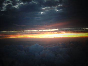 Scenic view of dramatic sky at sunset