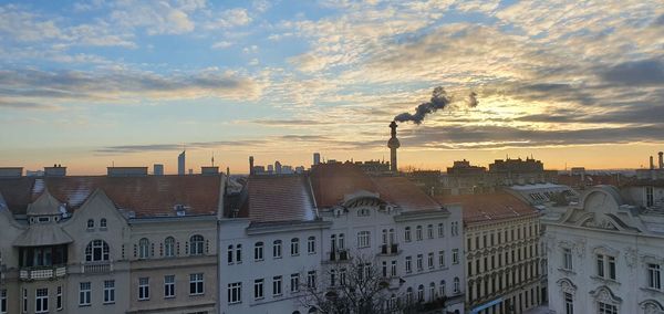 Buildings in city against sky during sunset in vienna austria