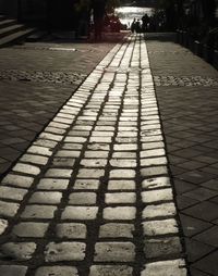 Shadow of cobblestone street