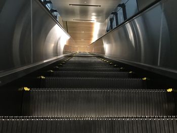 Interior of illuminated empty subway station