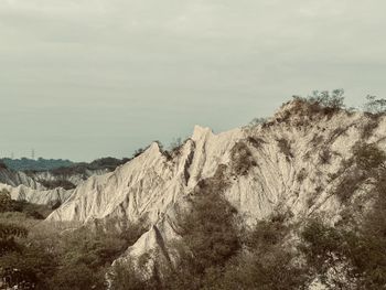 Scenic view of rocky mountains against sky