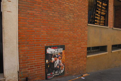 People on wall of building