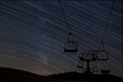 Low angle view of fire escape against sky at night