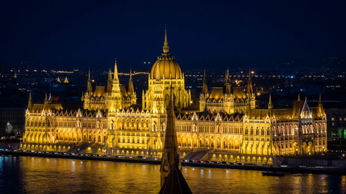 Illuminated city lit up at night