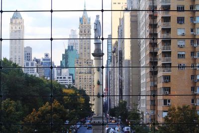 Buildings in city against sky