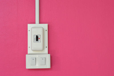 Close-up of electric light on wall