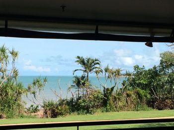 Scenic view of sea against cloudy sky