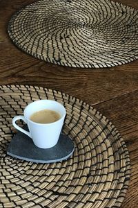 High angle view of coffee cup on table