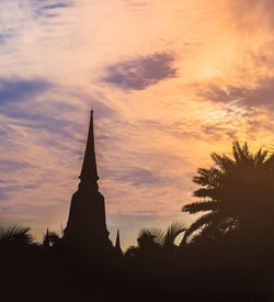 Low angle view of silhouette temple against sky during sunset