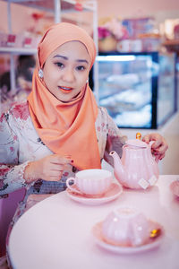 Portrait of young woman with ice cream