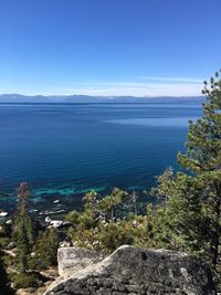 Scenic view of sea against blue sky