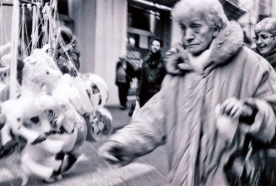 Blurred motion of people on road