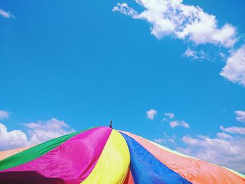 Low angle view of multi colored tent against sky