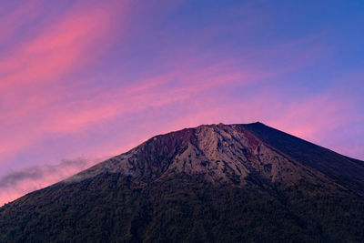 Low angle view of mount rinjani against sky during sunrise