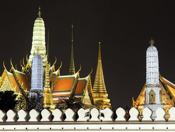 Panoramic view of buildings in city at night