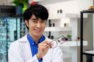 Portrait of doctor standing in laboratory