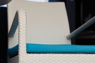 Close up of white chair on a terrace.