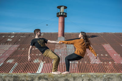 Low angle view of woman standing on steps