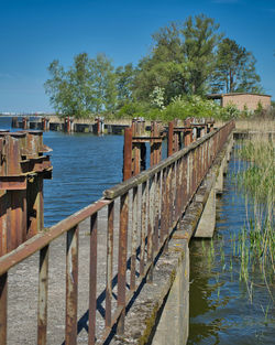 Bridge over river against sky