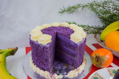 Close-up of cake and fruits on table during christmas