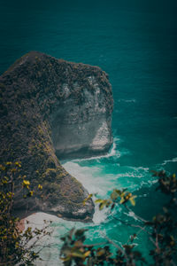 High angle view of rocks on sea