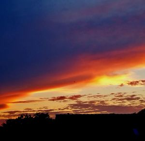 Low angle view of cloudy sky at sunset