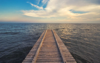 Pier over sea against sky