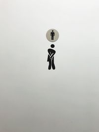 Restroom sign on white door