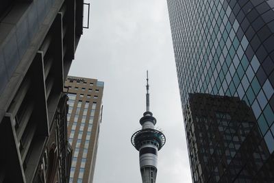 Auckland tv tower, communications tower, caught between some random skyscrapers.