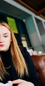 Portrait of beautiful woman sitting in hair