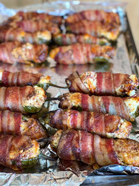 High angle view of meat on barbecue grill