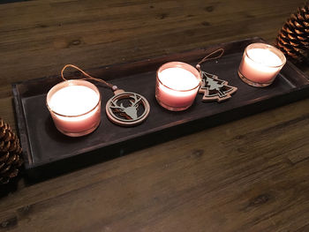 High angle view of tea light candles on table