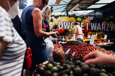 People at market stall