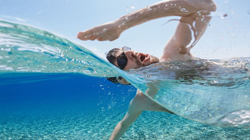 Man swimming in pool