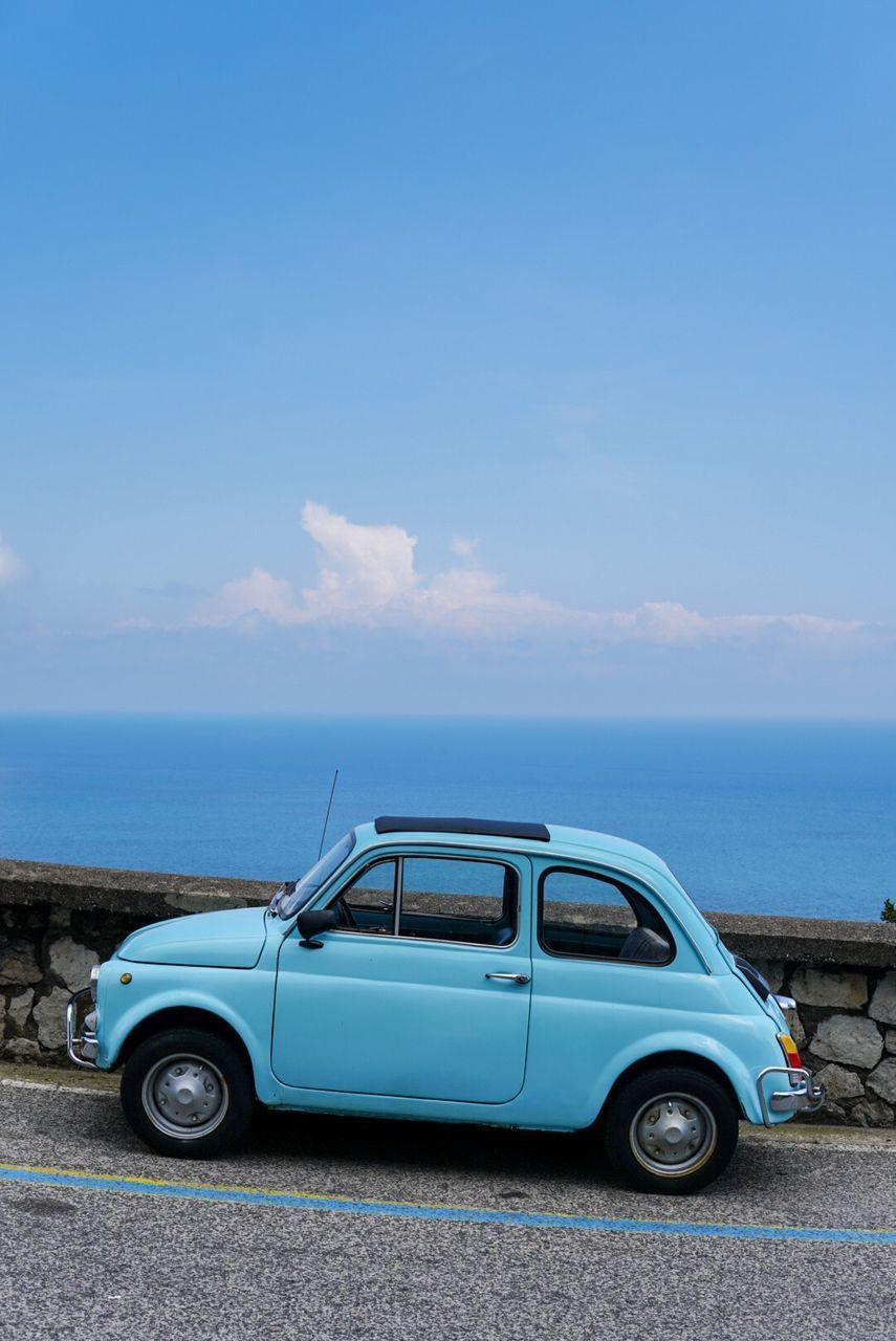 VINTAGE CAR ON BEACH