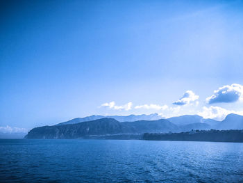 Scenic view of sea against blue sky