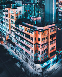 High angle view of buildings in city at night