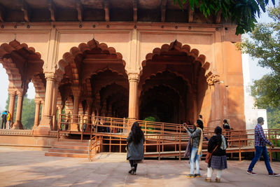 People walking in historic building