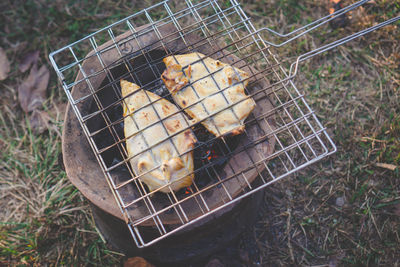 High angle view of meat on barbecue grill