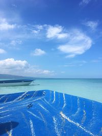 Scenic view of sea against blue sky