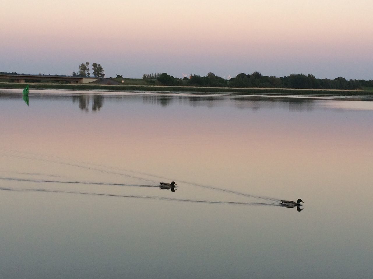 transportation, mode of transport, sunset, silhouette, water, flying, reflection, waterfront, nautical vessel, lake, scenics, travel, boat, nature, tranquility, tranquil scene, sky, beauty in nature, mid-air, orange color