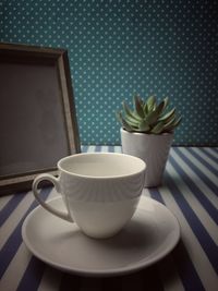 Close-up of coffee cup on table