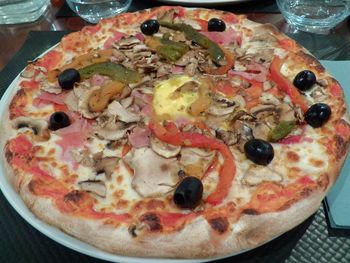 Close-up of pizza served on table