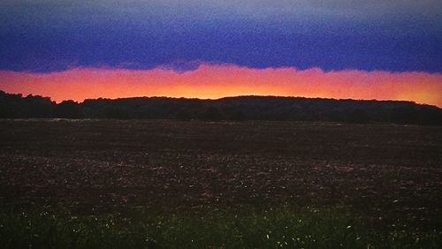 Scenic view of landscape at sunset