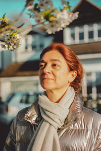 Portrait of woman looking away outdoors