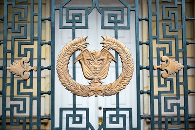 Coat of arms on metallic wall