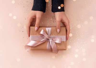 Midsection of woman holding gift box