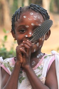 Portrait of young woman drinking water