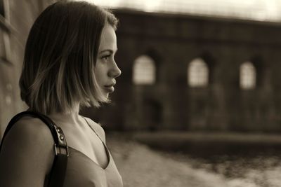 Portrait of a young woman looking away